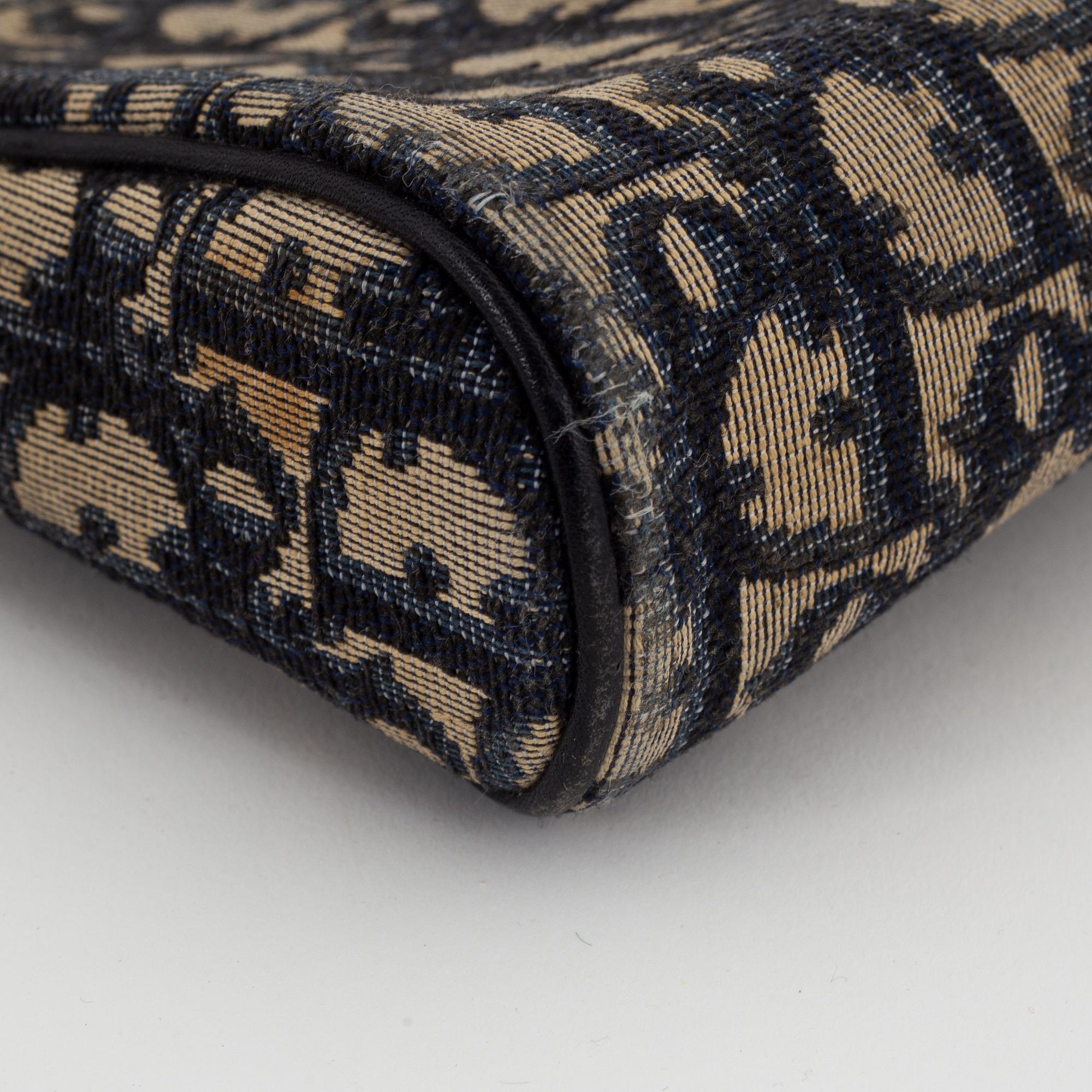 Christian Dior, a canvas handbag, toilet bag and key holder.