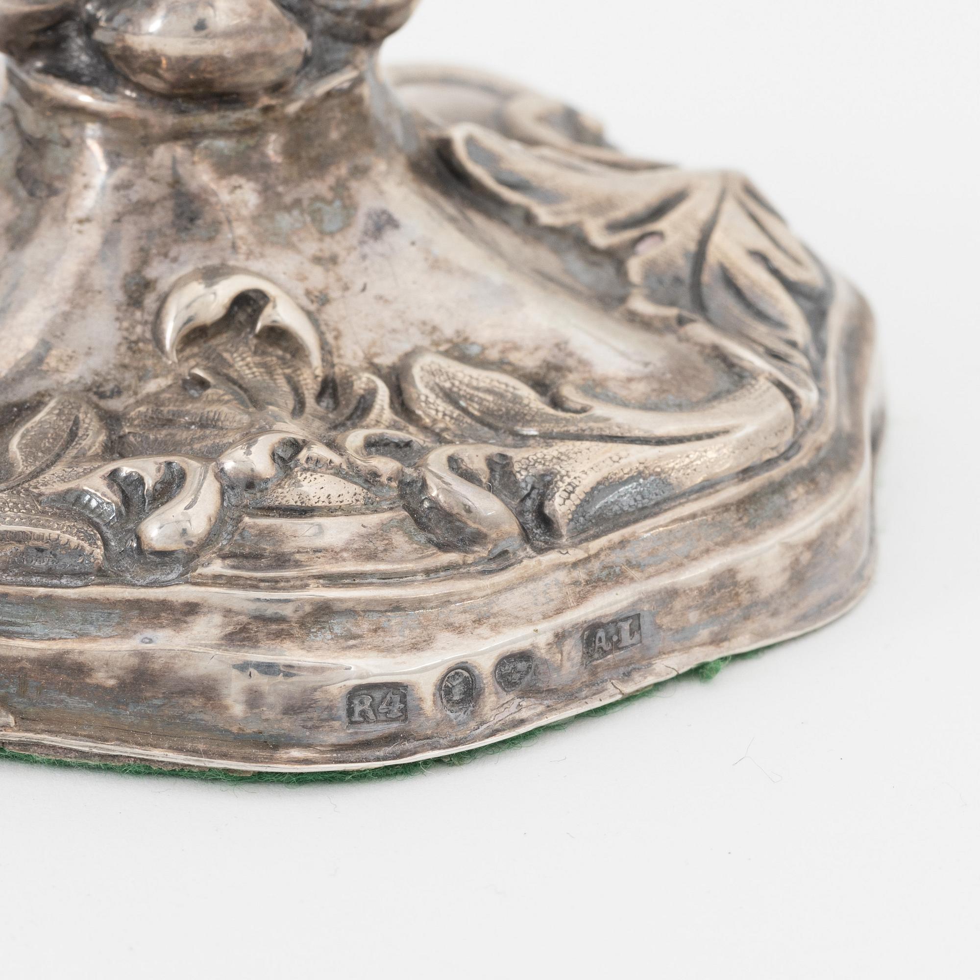 Two pairs of Swedish silver candlesticks, mark of A Lundqvist, Stockholm 1847 and JW Laurén, Stockholm 1854.