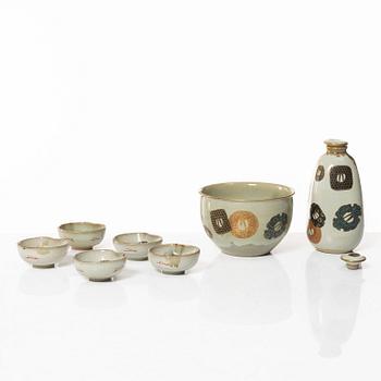 A Japanese stoneware sake service, seven pieces, 20th century.