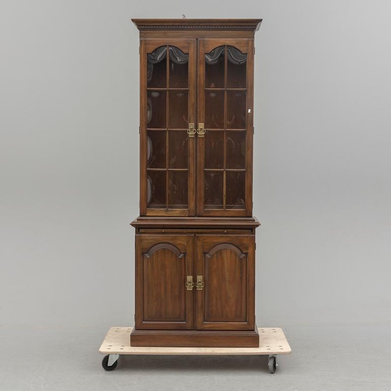 A second half of the 20th century vitrine cabinet marked "Pennsylvania House".
