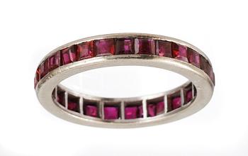 612. ETERNITYRING, set with carré cut rubies.