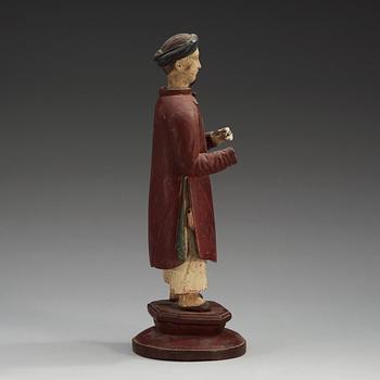 A painted wooden export figure of a China man, Qing dynasty, 18th Century.