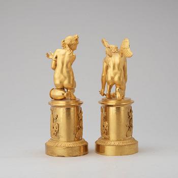 A pair of early 19th century Empire gilt bronze table sculptures.