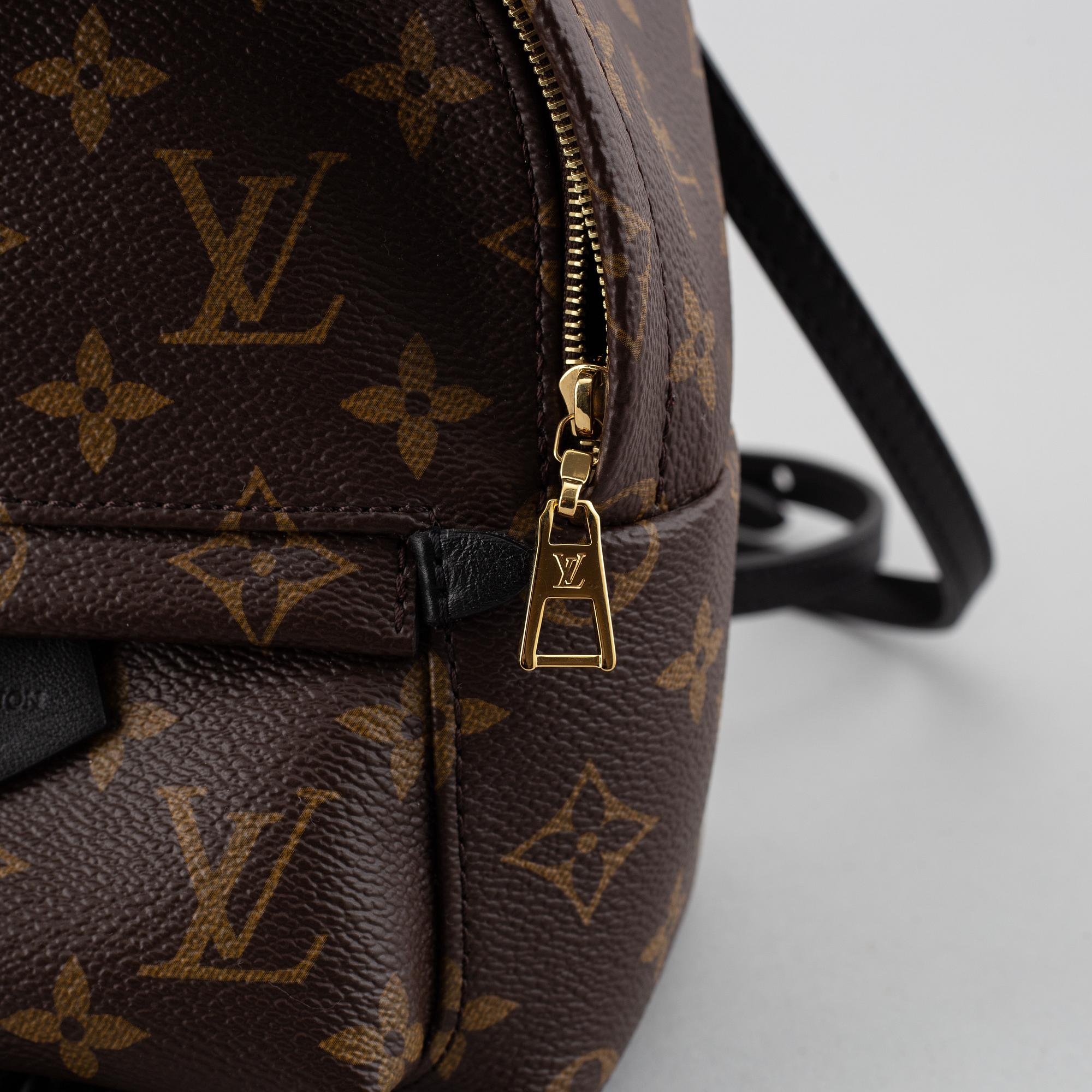 louis vuitton backpack 2018 Black White Epi Apollo M52186 Adjustable textile straps and a top handle give carry options. LOUIS VUITTON, a 'Palm Springs