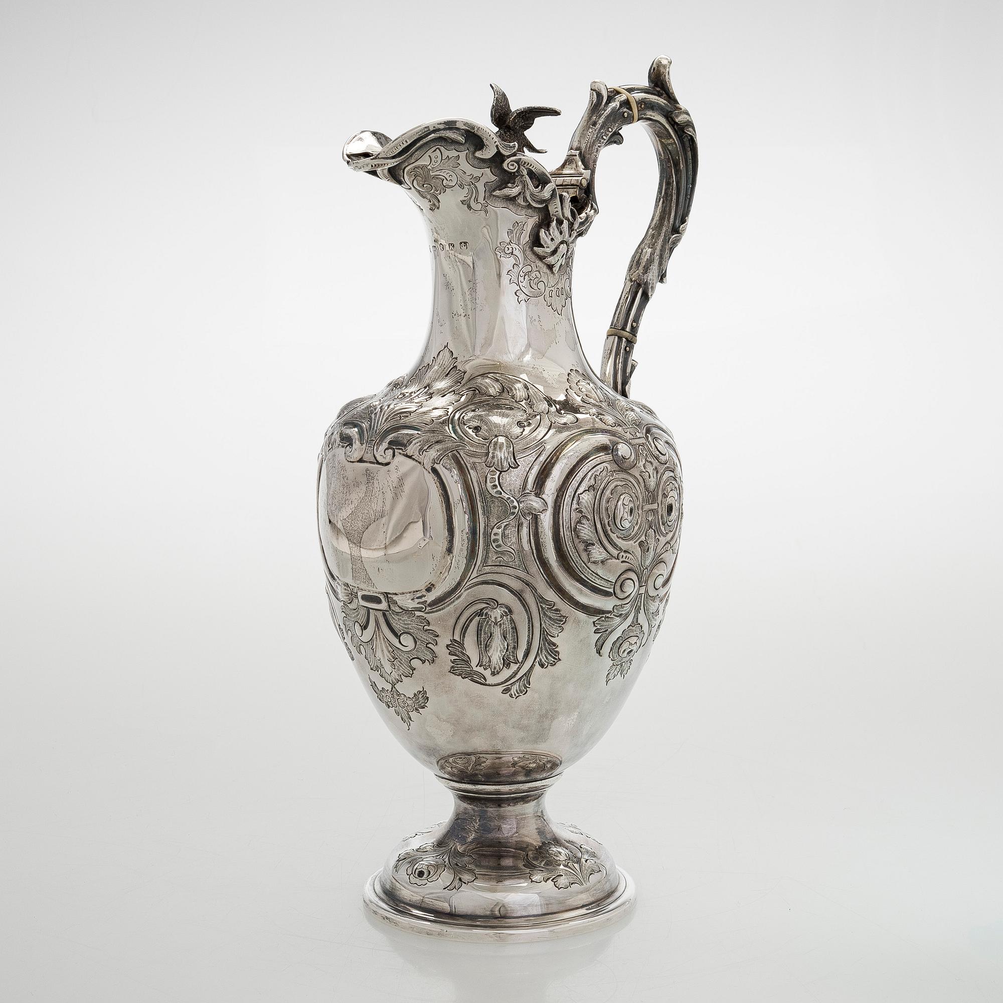 A sterling silver jug, maker's mark of Martin, Hall & Co, Sheffield 1877.