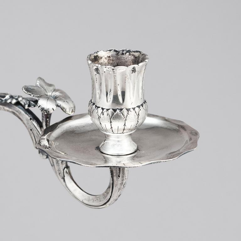 A pair of Swedish 18 century silver candelabras, mark of Lars Åkerblom Gävle 1775, arms by Christian Kullberg.