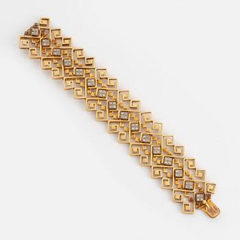 An Ilias Lalounis 18K gold bracelet set with eight-cut diamonds.