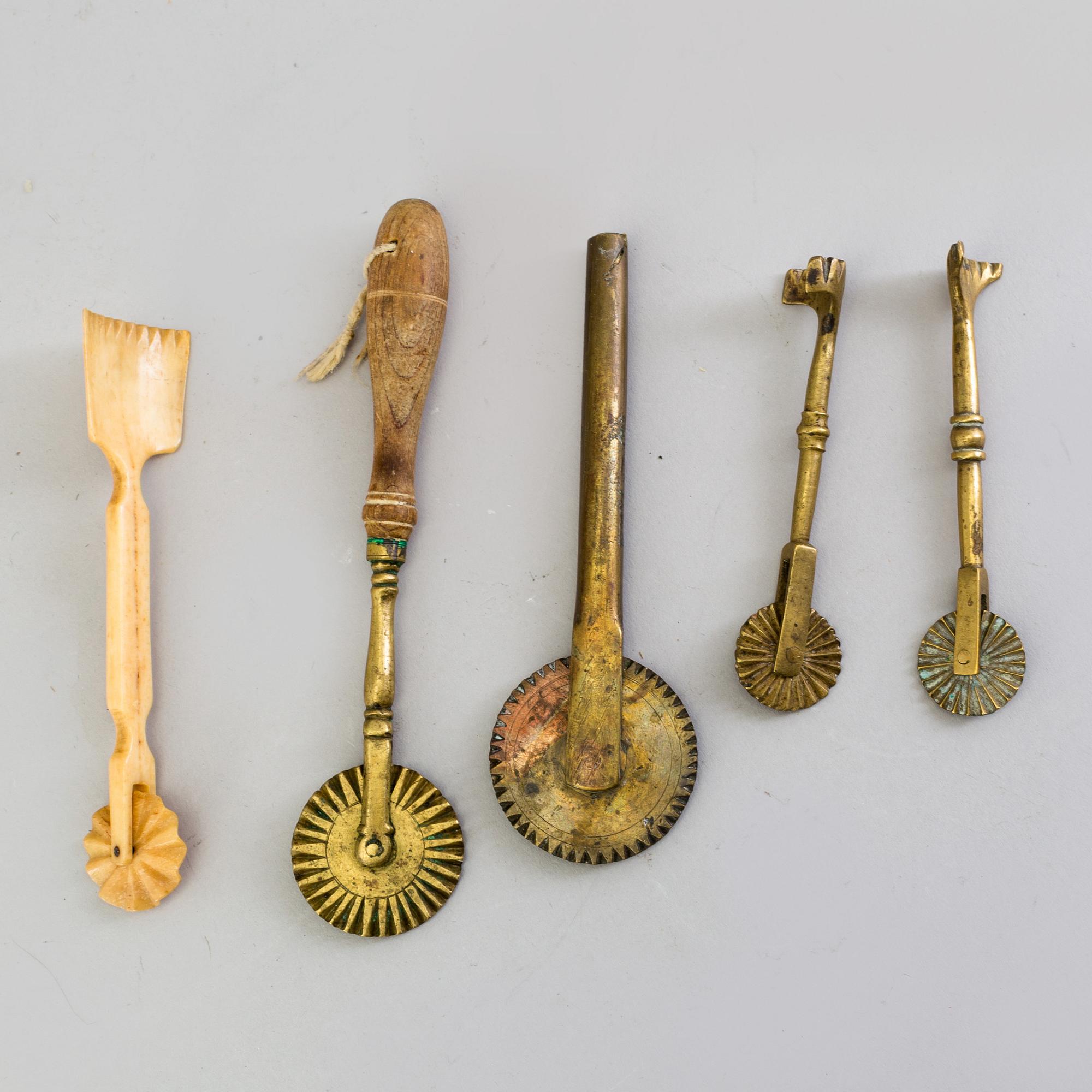 FIVE BAKING UTENSILS, bronze, bone and wood, 18th century.