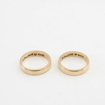 Wiwen Nilsson, a pair of 18K gold rings with a box shaped like a hymn book, Lund 1970.