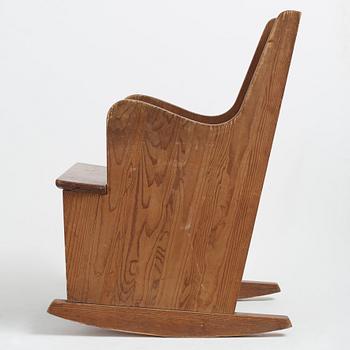 Axel Einar Hjorth, a stained pine "Lovö" rocking chair, Nordiska Kompaniet, 1930's.