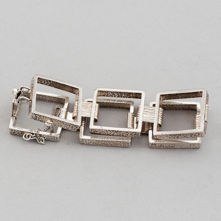 Two silver bracelets, including Denmark.