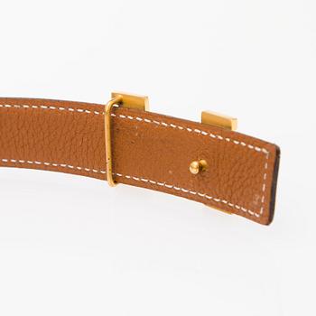 A REVERSIBLE LEATHER BELT, size 90. 2003.