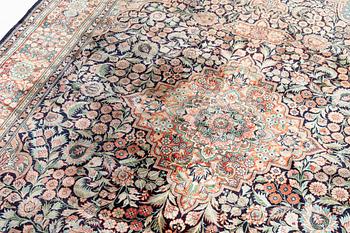 An oriental carpet, mercerized cotton, c. 275 x 182 cm.