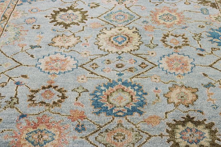 An oriental carpet with Mamluk design, c. 302 x 252 cm.