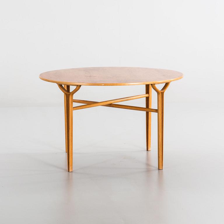 AN AX COFFE TABLE BY HVIDT & MOLGAARD.