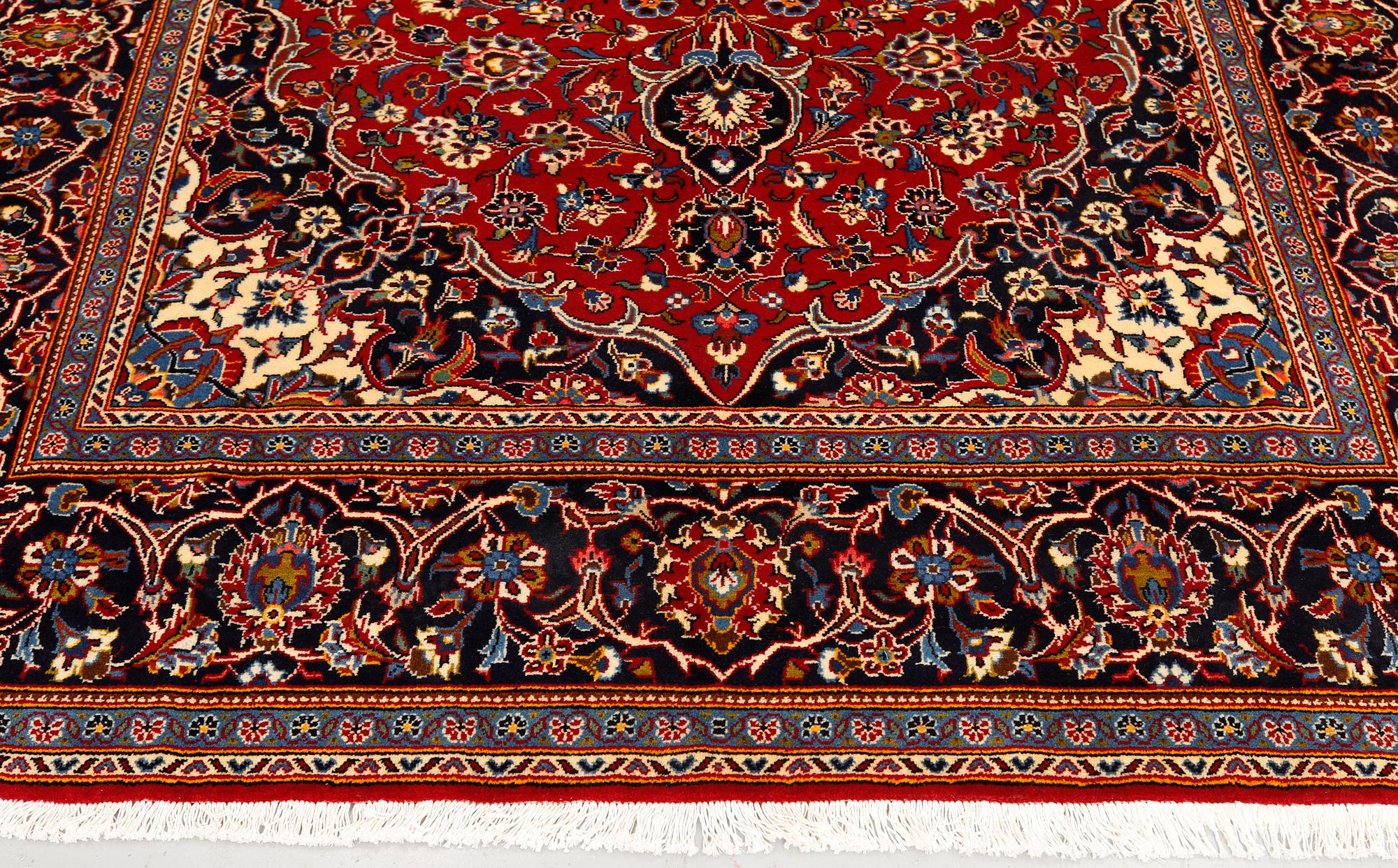 A Kashan carpet, approximately 315 x 200 cm.