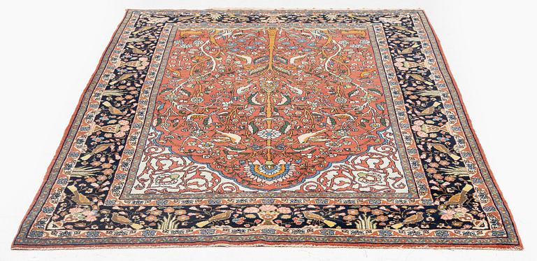 An antique 'Manchester' Kashan rug, central Persia, c 222 x 133 cm.