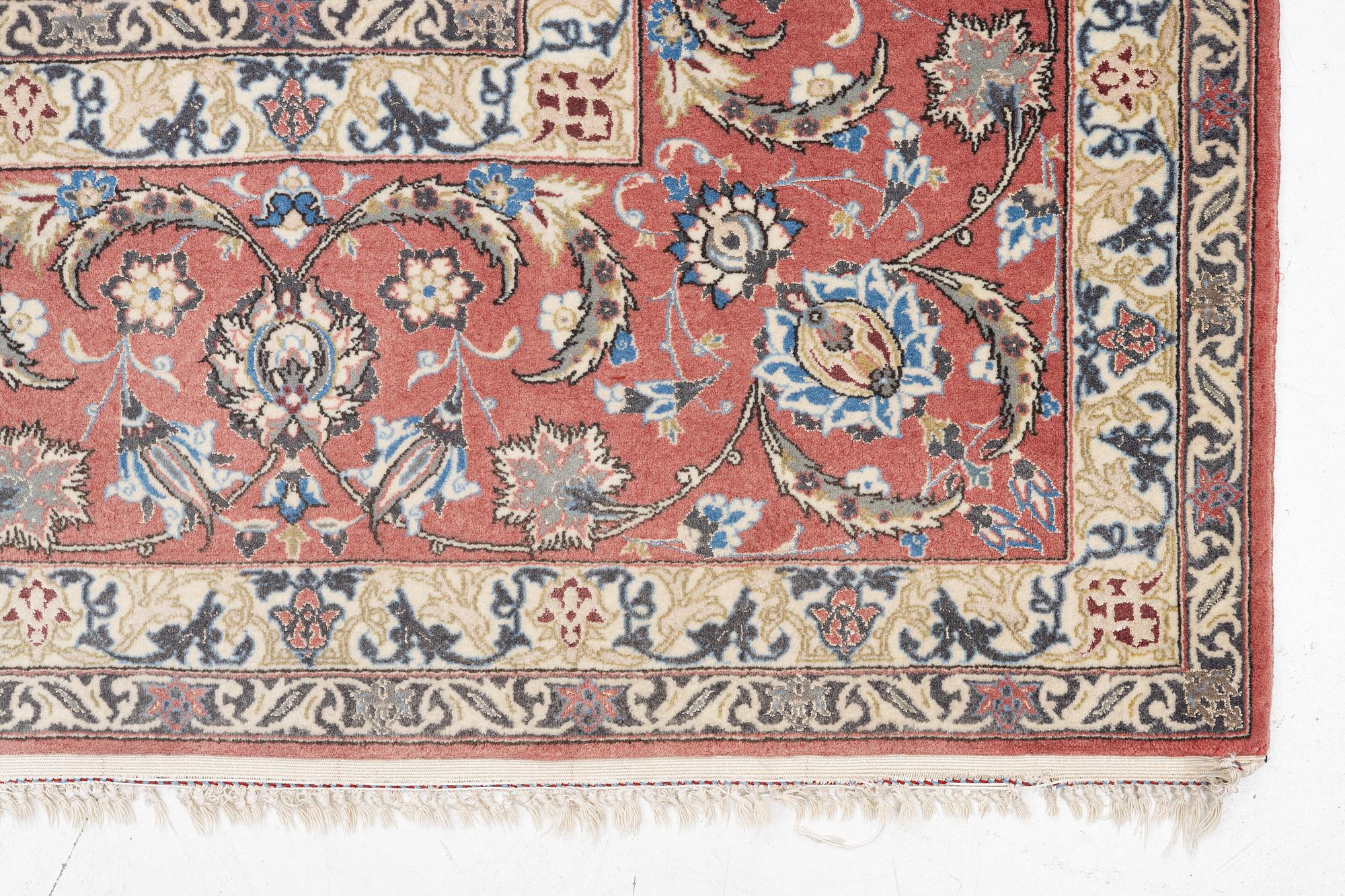 An Isfahan carpet, signed, approx. 372 x 255 cm.