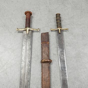 Two East African Kaskara swords- One with scabbard. 19-20th Century.