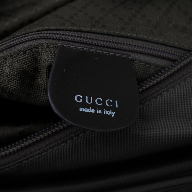 GUCCI, a green nylon handbag.