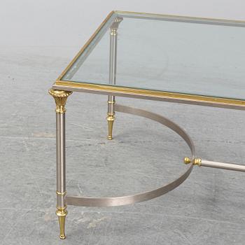 A 1970s sofa table, brass and glass.