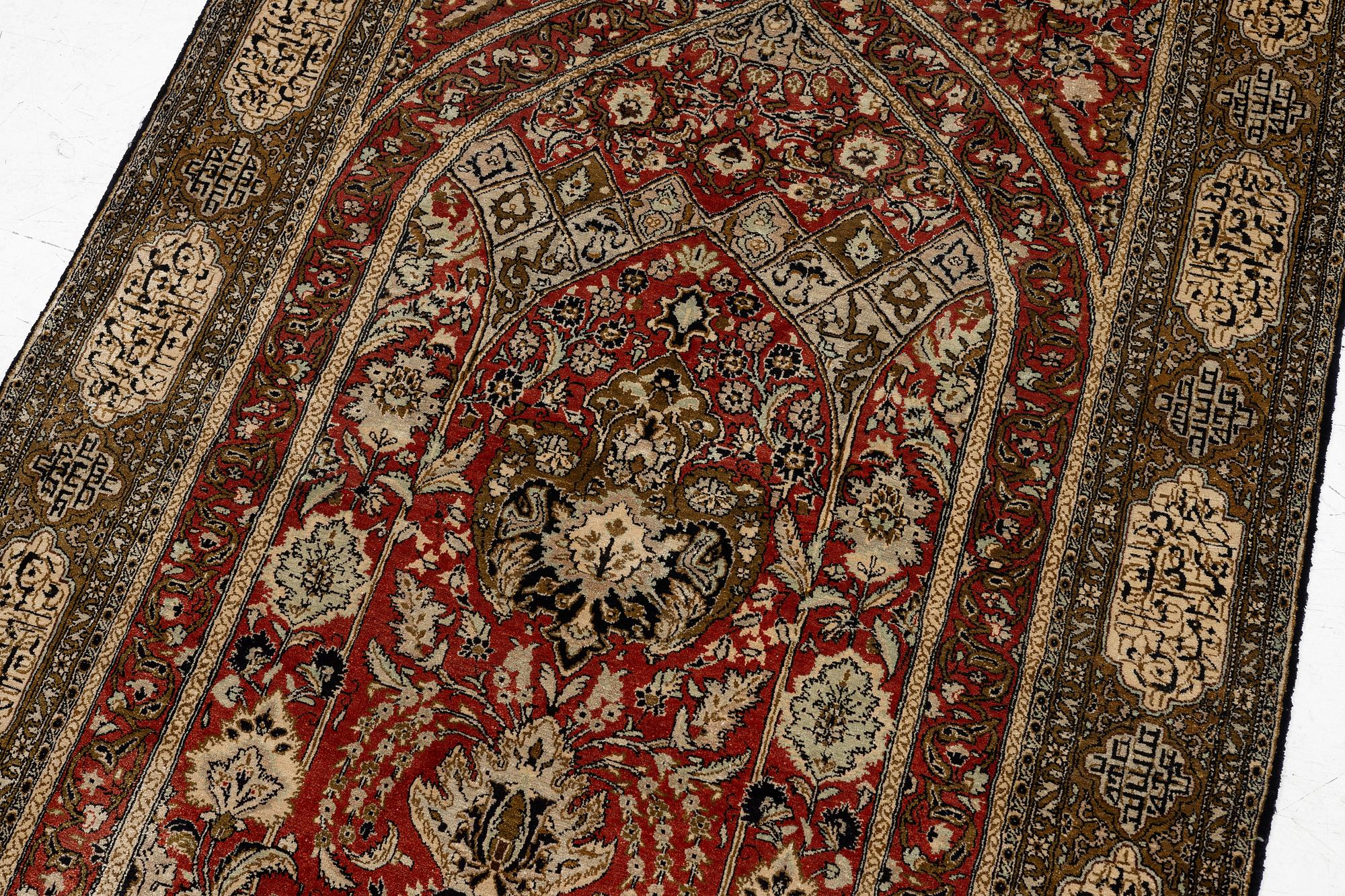 A silk Qum rug, c. 172 x 105 cm.