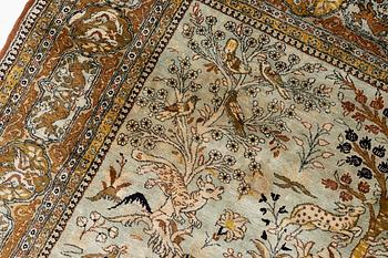 A Ghom, figural, silk rug, c. 205 x 140 cm.