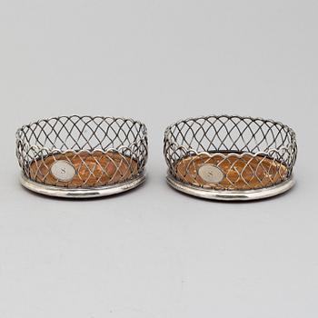 An English pair of 19th century silver plated coasters.