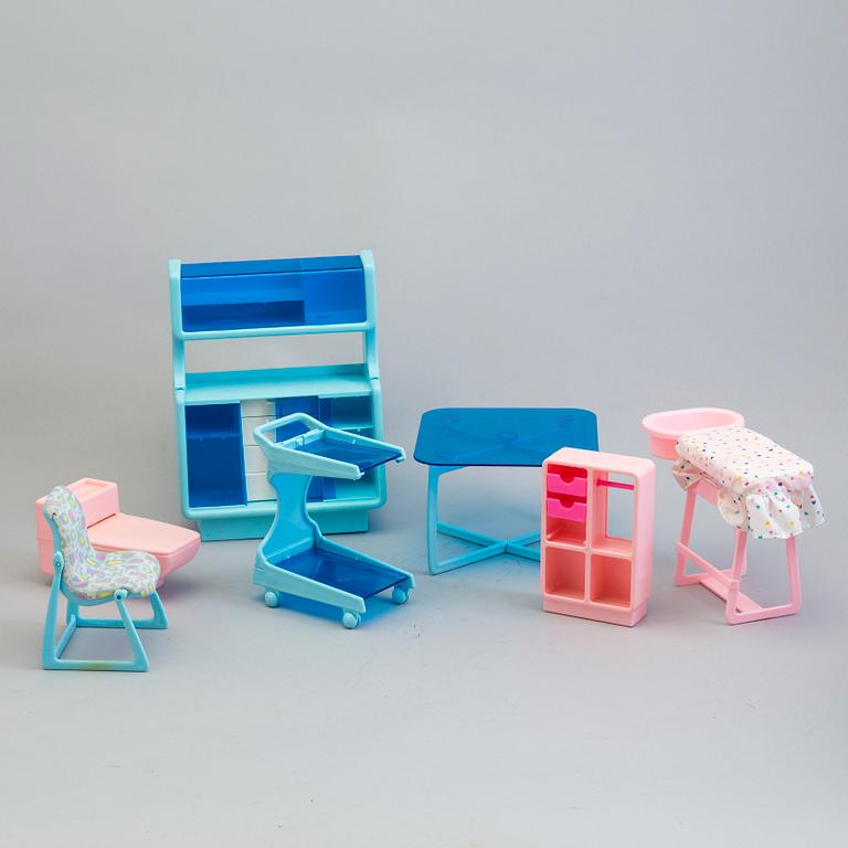 A plastic doll's house with six dolls, furniture and clothes, 20th century.