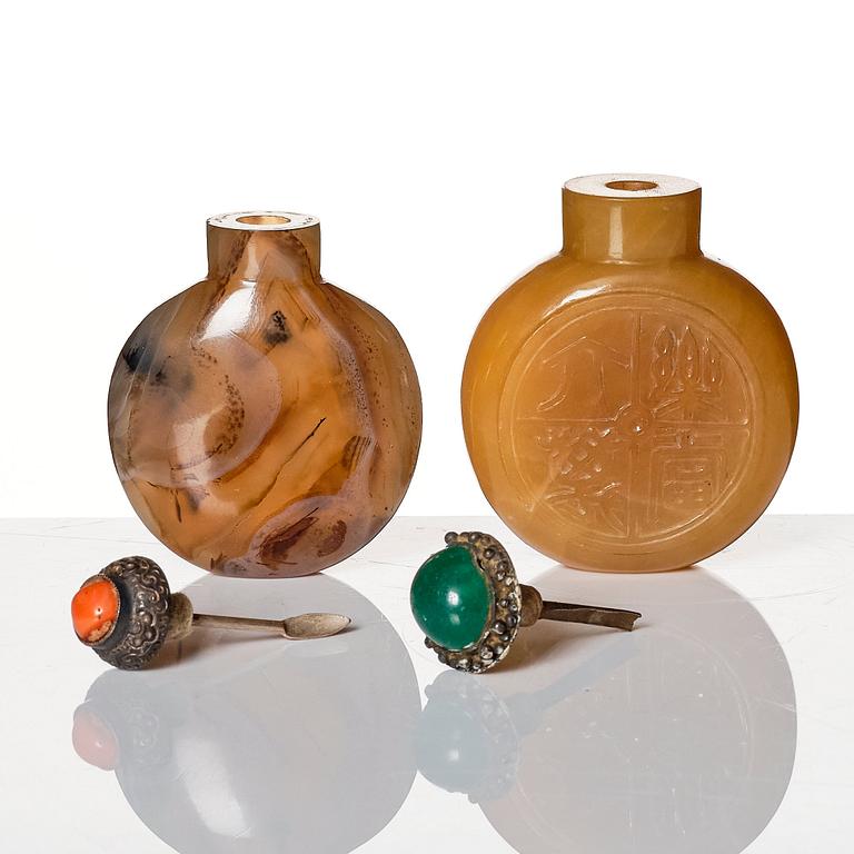 A set of four Chinese snuff bottles and a sculpture, 20th Century.