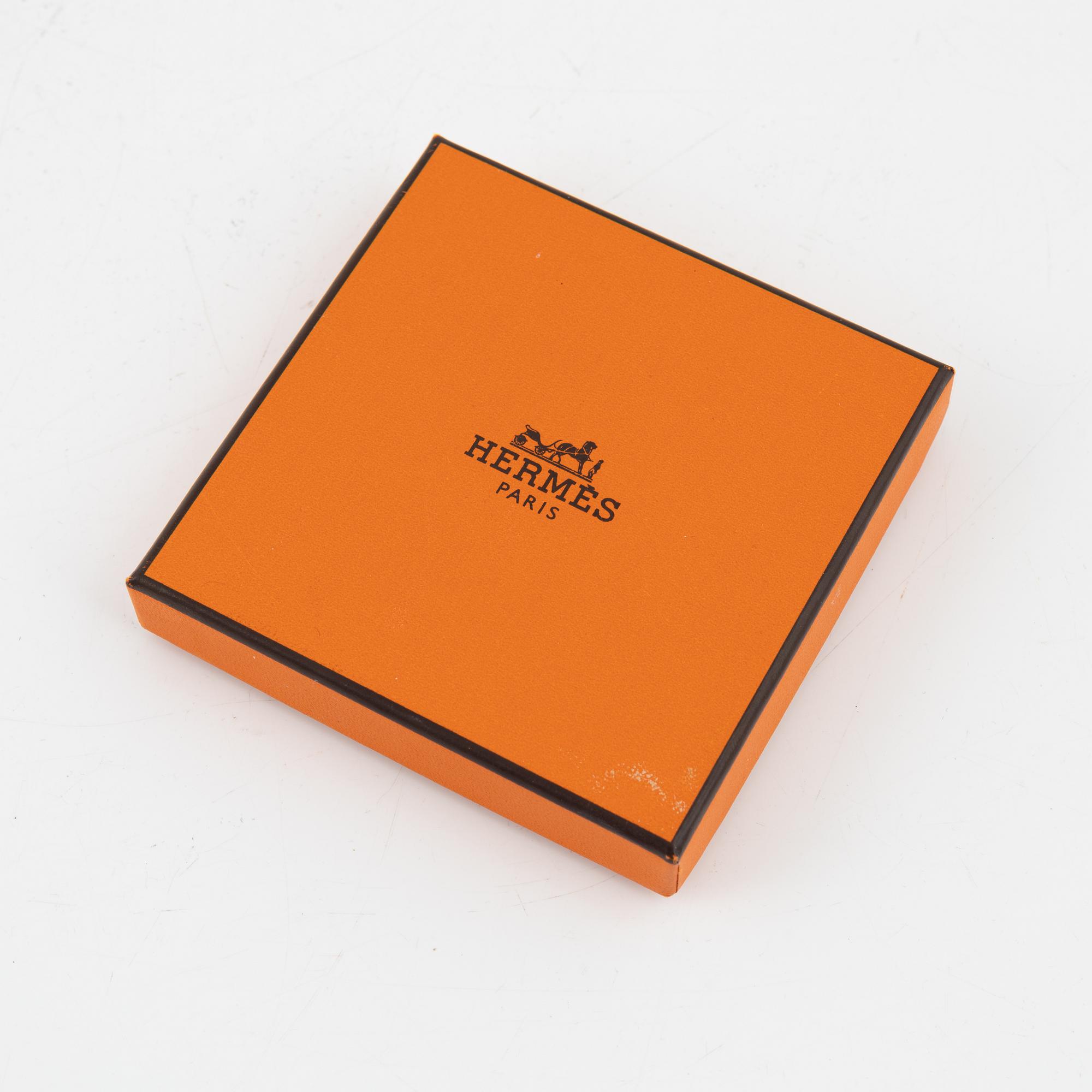 Hermès, a 'Clic H' bracelet.