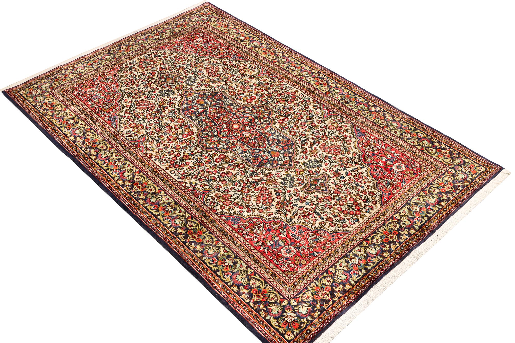 A Ghom rug, c. 202 x 137 cm.