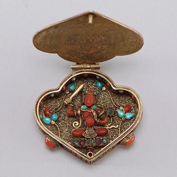 A filigree and jewelled Sinotibetan pendant/box, late 19th Century.