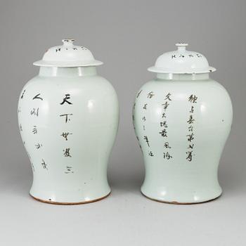 A pair of Chinese famille rose vases with covers, 20th century.
