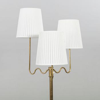 A BRASS FLOOR LAMP MID 20TH CENTURY.