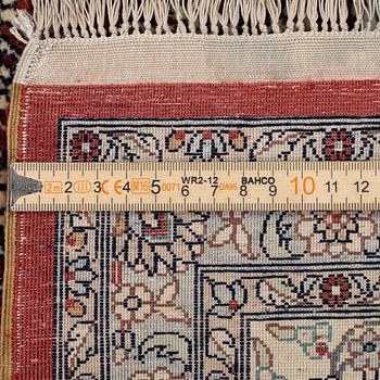 Carpet, part silk, approx. 240 x 158 cm.