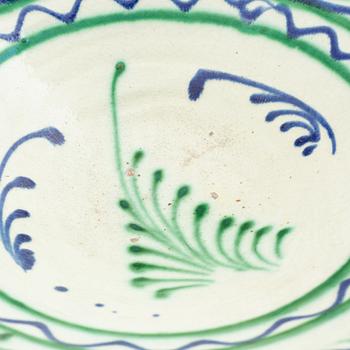 A faience bowl, circa 1900.