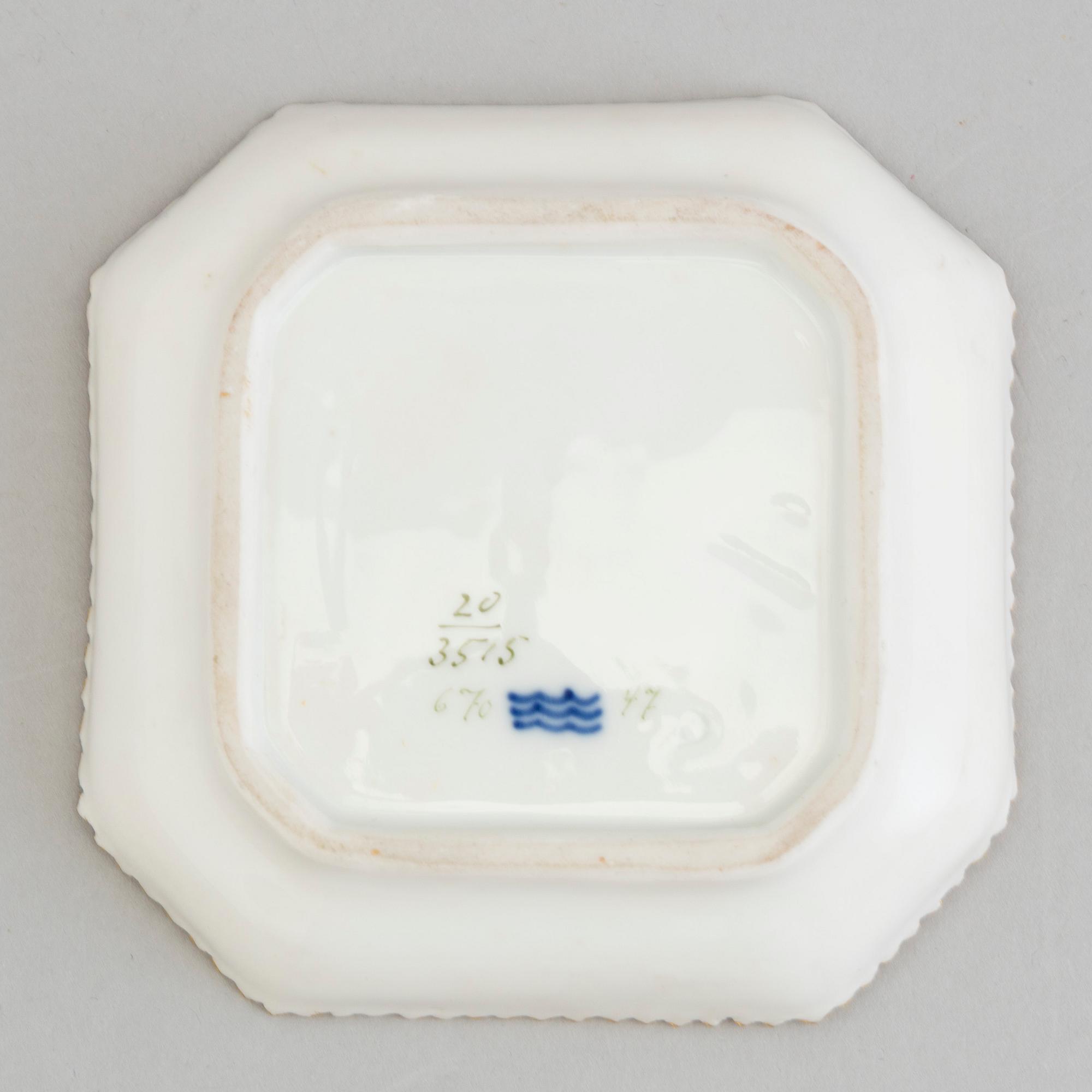 A Royal Copenhagen 'Flora Danica' custard cup with lid and plate model #3514 and #3515.