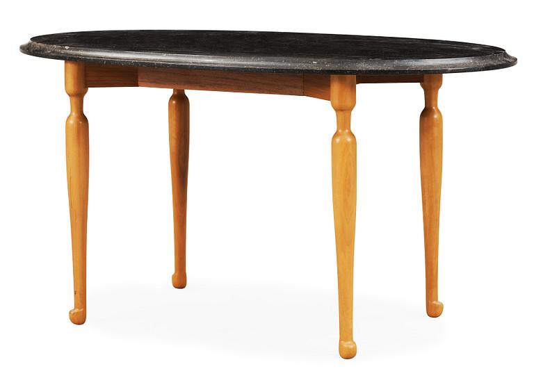 A Josef Frank black marble top table on a mahogany and walnut base, Svenskt Tenn, Sweden.