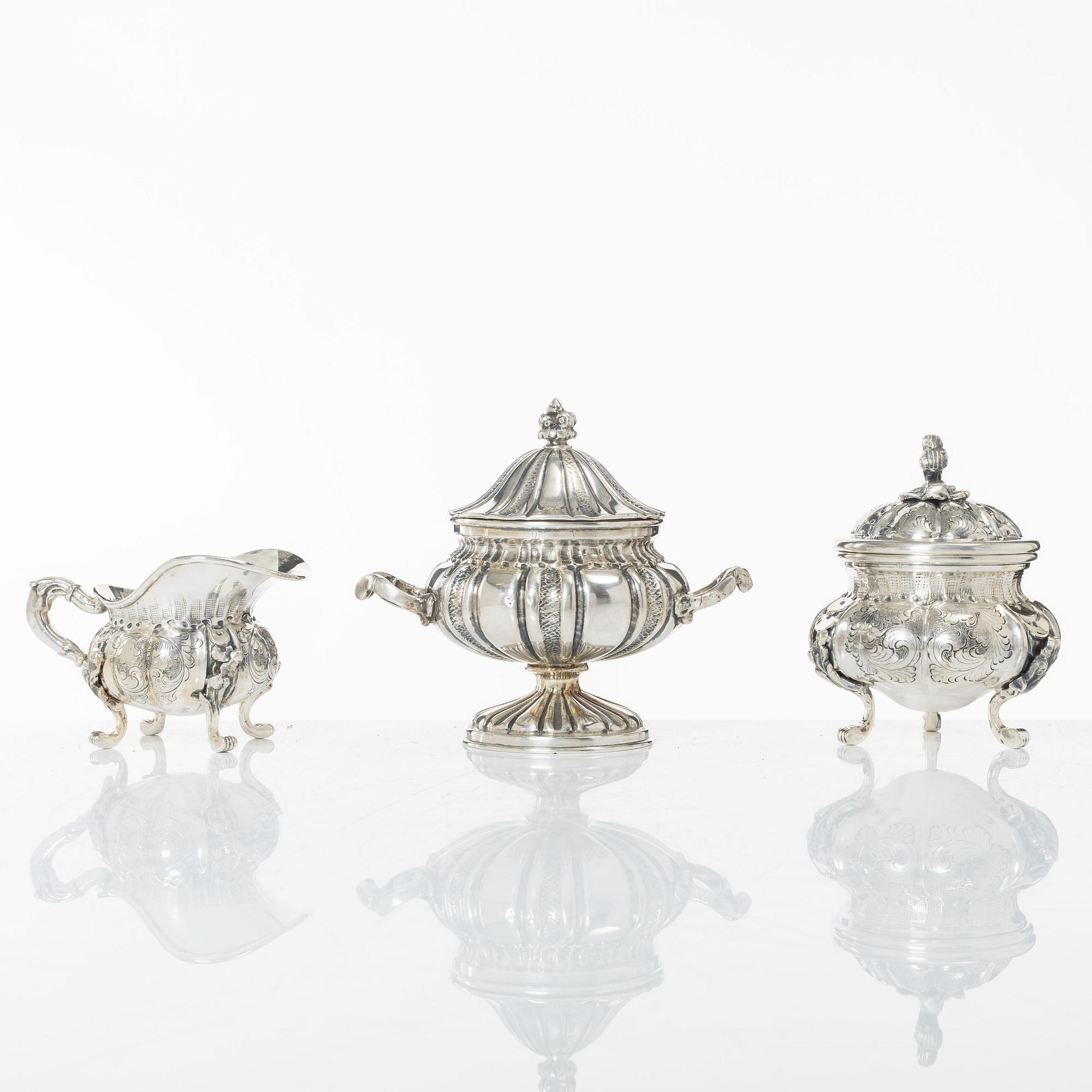 A silver sugar bowl and a set with creamer and sugar bowl, silver, 20th century.