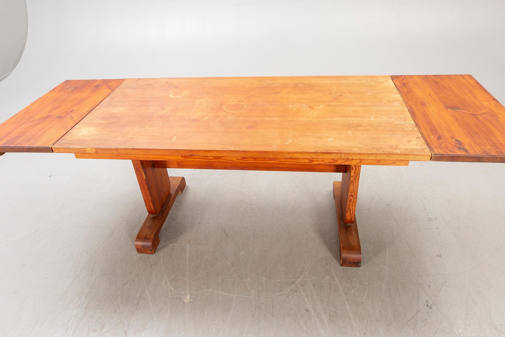 A 1940s pine dining table.
