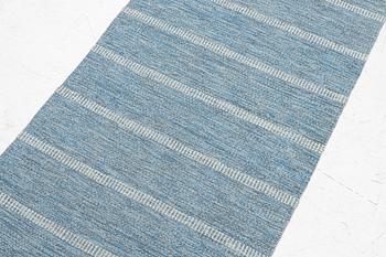 A flat weave runner, mid-20th century, c. 268 x 70 cm.