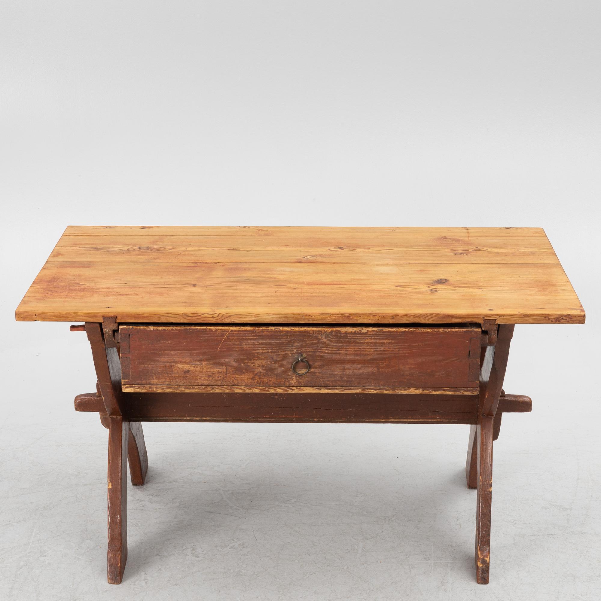 A Swedish folk-art trestle table from Dalarna, dated 1854.