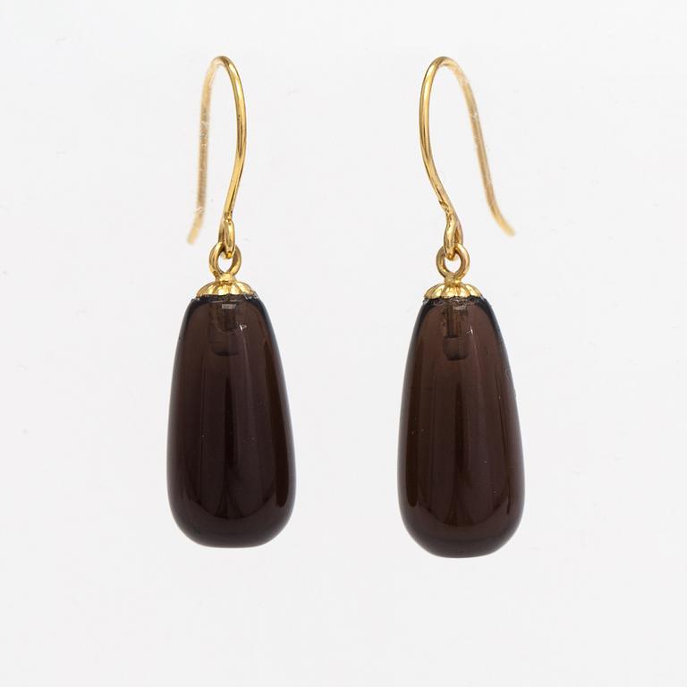 A pair of 14K gold earrings with smoaky quartzes.