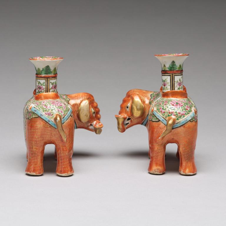 A pair of famille rose Canton elephant candle holders, late Qing dynasty, about 1900.