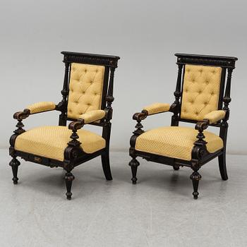 A pair of late 19th century armchairs.