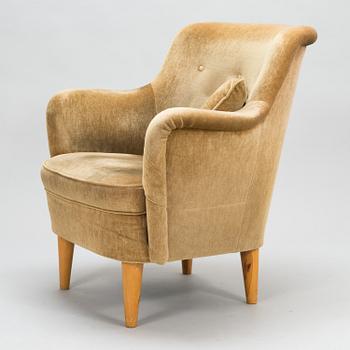 A mid-20th-century sofa and armchair.
