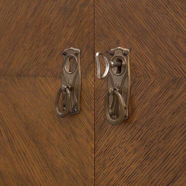 An early 20th century bookcase /  cabinet.