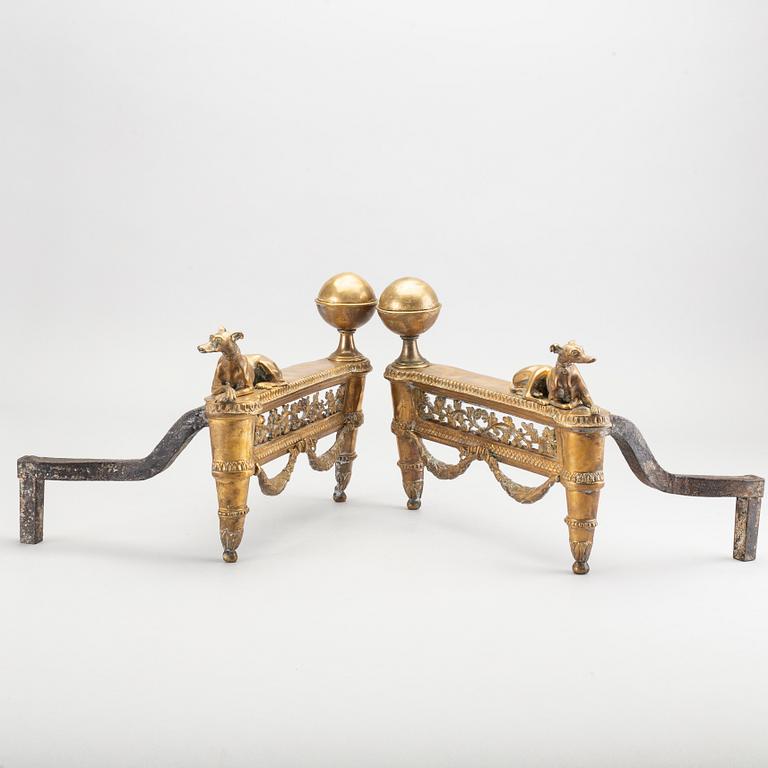 A pair of Louis XVI 18/19 century fire dogs.