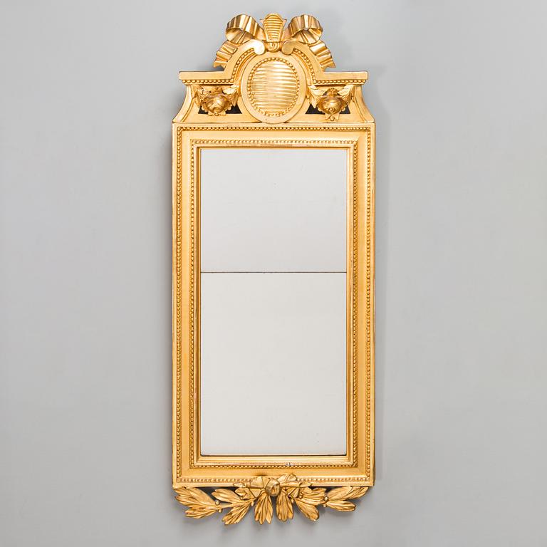 A Gustavian mirror signed Johan Åkerblad (master in Stockholm 1758 - 1799), dated 1785.